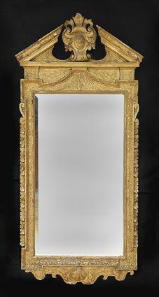 Appraisal: GEORGE II CARVED GILTWOOD MIRROR The later beveled plate within