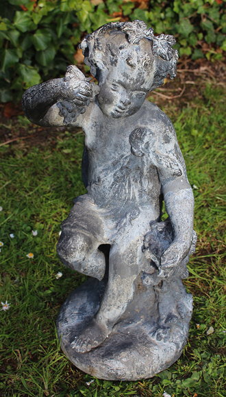 Appraisal: AN ANTIQUE LEAD FIGURE OF A BACCHANALIAN BOY with vine