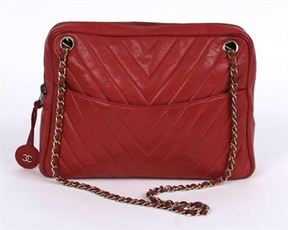 Appraisal: Chanel chevron-quilted red leather purse Rectangular bright red top-zip bag