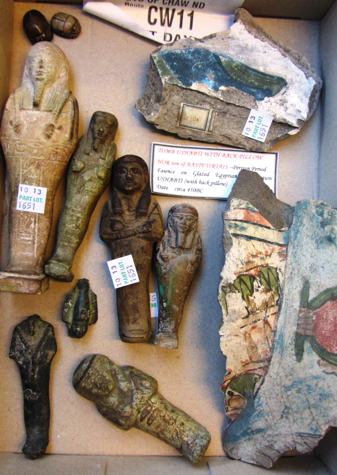 Appraisal: Five Egyptian shabtis including a New Kingdom white glazed shabti