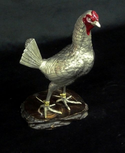 Appraisal: A plated model of a game cock the head with