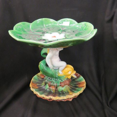 Appraisal: Majolica Figural Pottery Compote putti riding on a dolphin water