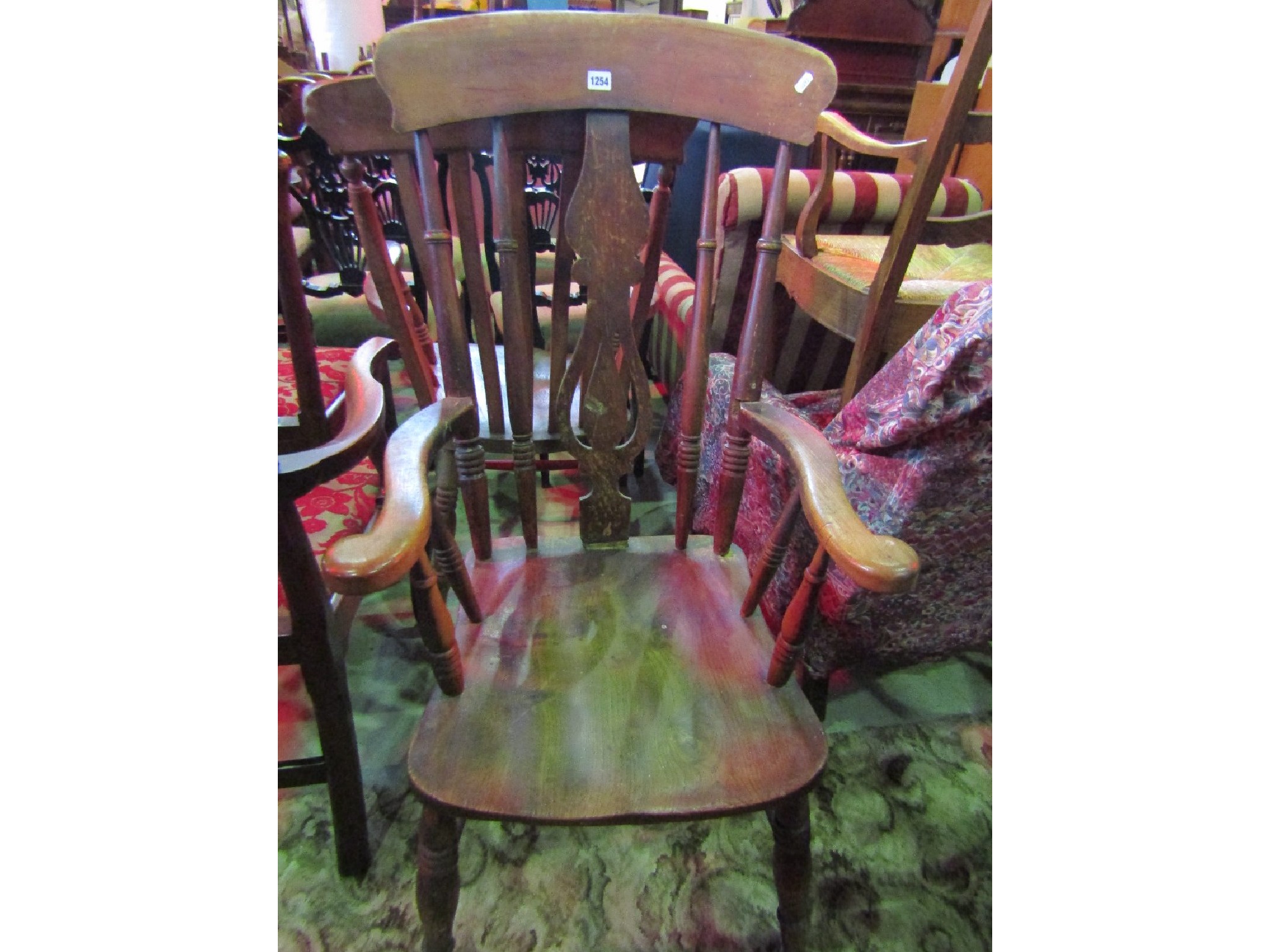 Appraisal: A th century Windsor elm and beechwood armchair the turned