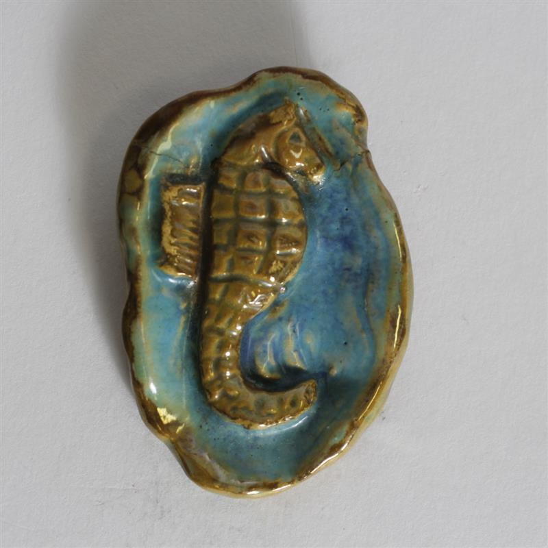 Appraisal: Pewabic art pottery oval seahorse brooch Blue and yellow pearlescent