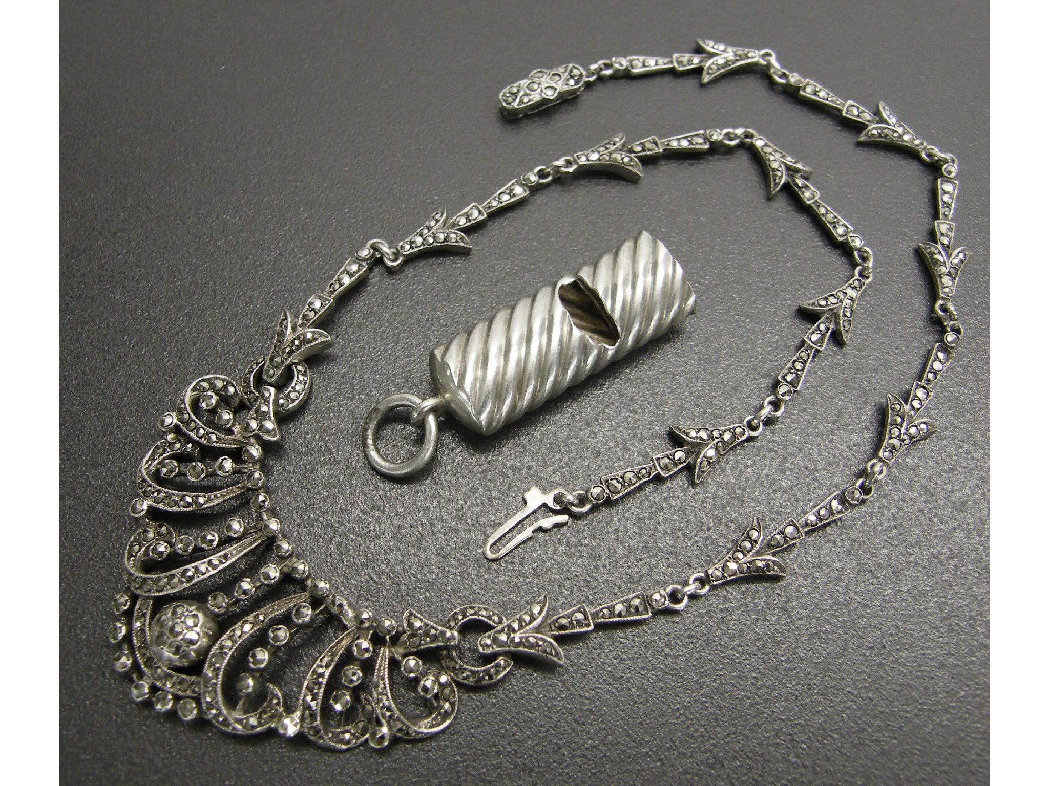 Appraisal: Silver marcasite necklet long together with a silver whistle pendant