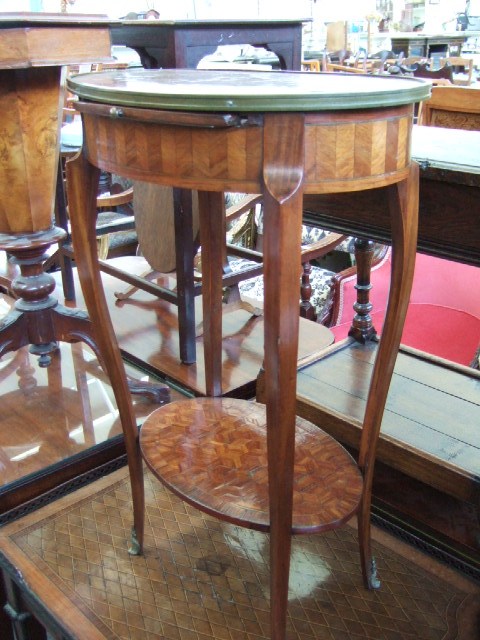 Appraisal: A th century French oval kingwood occasional table the parquetry