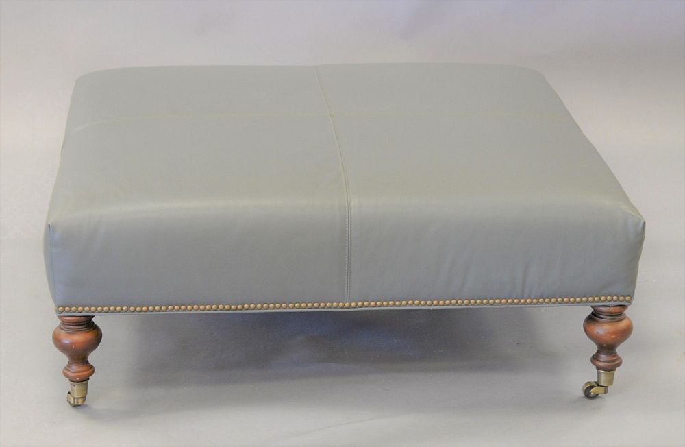 Appraisal: Decorative Regency-style leather upholstered ottoman ht top x Estate of