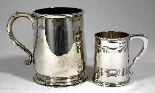 Appraisal: A late Victorian silver christening mug the tapered sides with