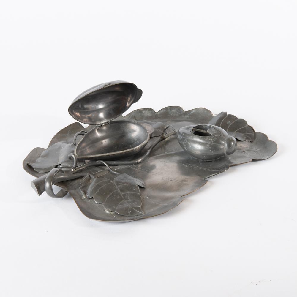 Appraisal: CHINESE HAND-WROUGHT PEWTER TOBACCO TRAY A hand-wrought leaf-form pewter tray