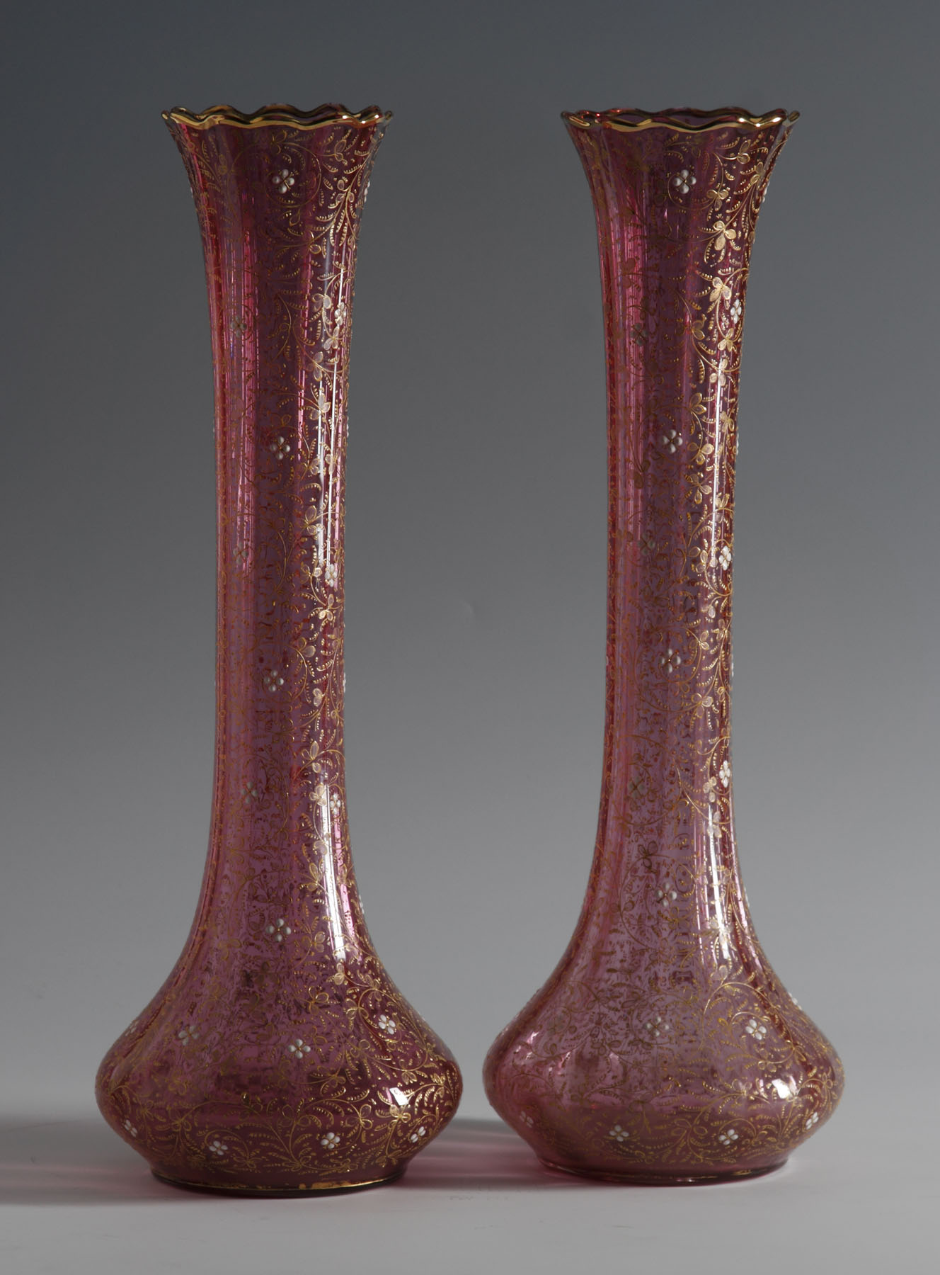 Appraisal: th Century Bohemian Cranberry Vases Possibly Moser Enameled floral design