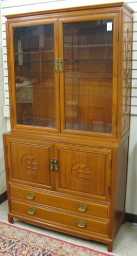 Appraisal: TEAKWOOD CHINA DISPLAY CABINET-ON-BUFFET Chinese th century The top section