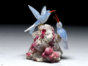 Appraisal: BLUE CHALCEDONY HUMMINGBIRD COUPLE ON GEM TOURMALINE This life size