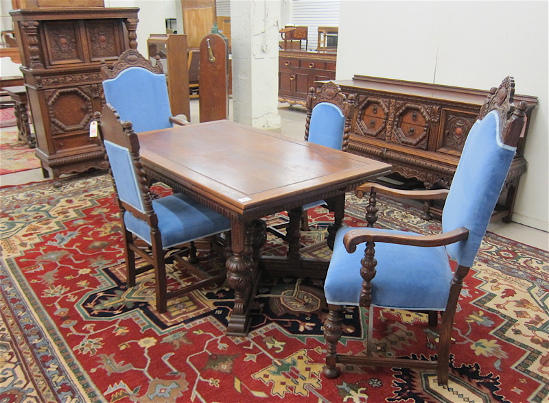 Appraisal: NINE-PIECE HIGHLY CARVED OAK DINING FURNITURE SET English Elizabethan Revival