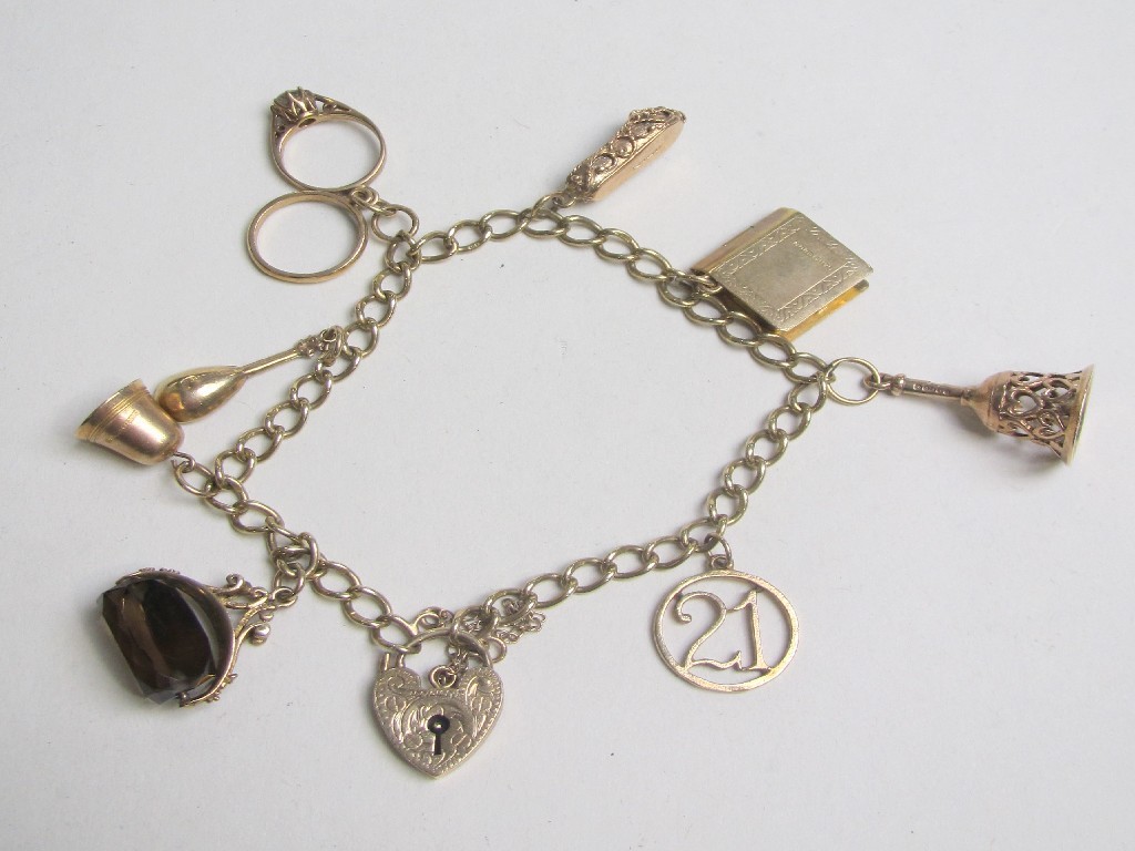 Appraisal: Nine carat gold charm bracelet with eight various charms Approximately