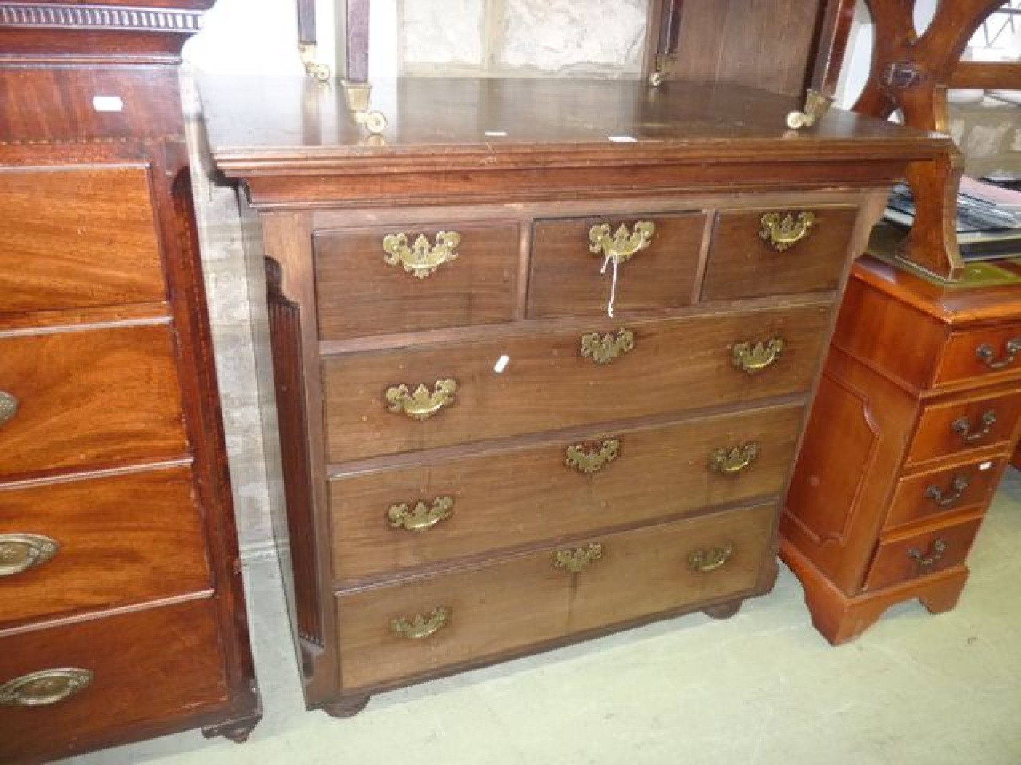 Appraisal: A Georgian mahogany chest of three long and two short