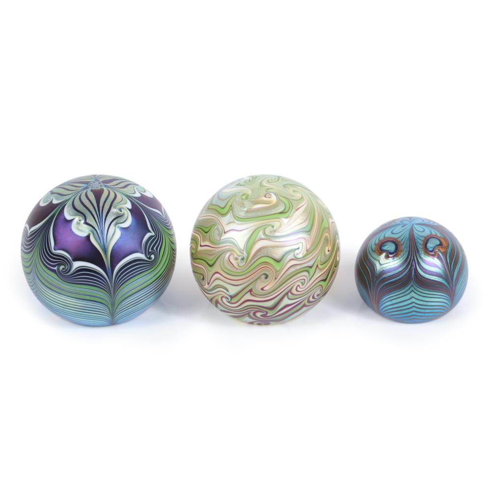 Appraisal: THREE ORIENT FLUME STUDIO ART GLASS PAPERWEIGHTS WITH IRIDESCENT PULLED