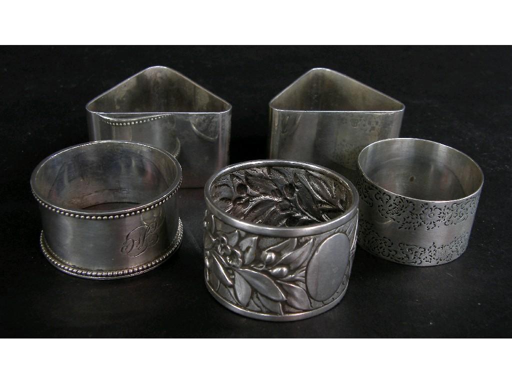 Appraisal: Circular napkin ring deeply embossed with leaves flowers and berries