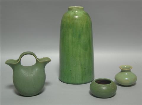 Appraisal: FOUR GREEN GLAZED PIECES The first Grueby Faience short vase