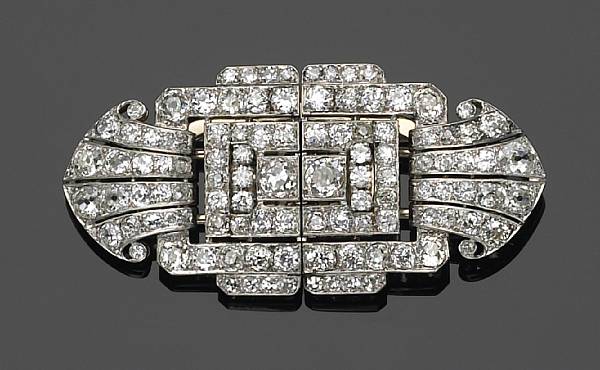 Appraisal: A diamond and platinum-topped gold double-clip brooch together forming a