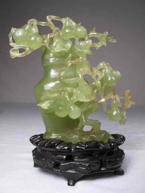 Appraisal: Chinese carved green quartz covered urn Carved to resemble a