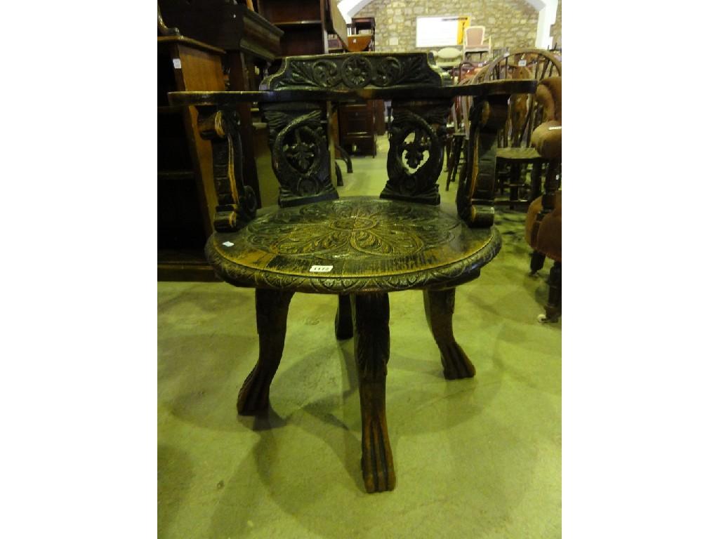 Appraisal: A Victorian oak swivel desk library chair with carved scrolling