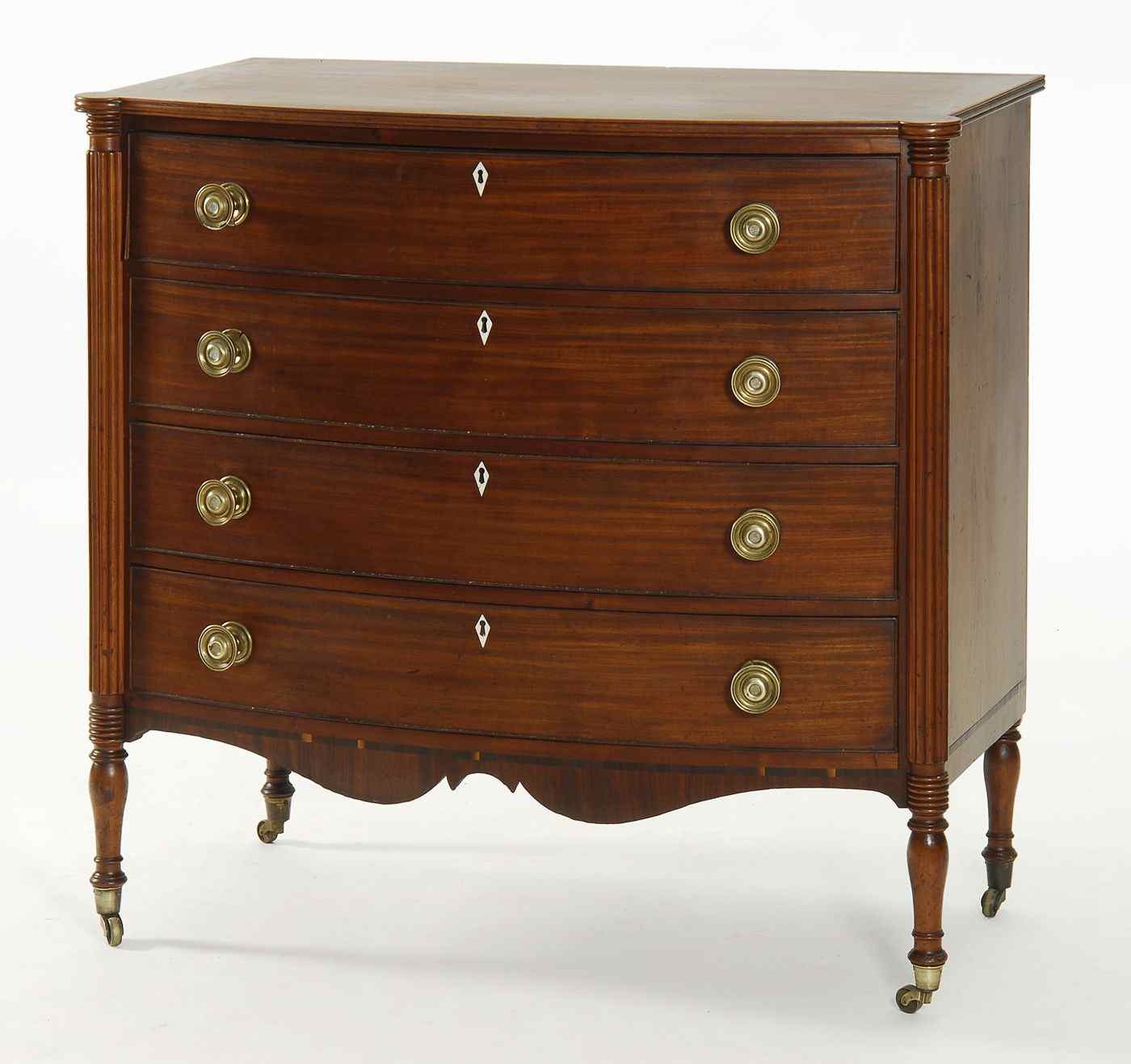 Appraisal: ANTIQUE AMERICAN SHERATON FOUR-DRAWER BOWFRONT CHESTCirca In mahogany with porringer