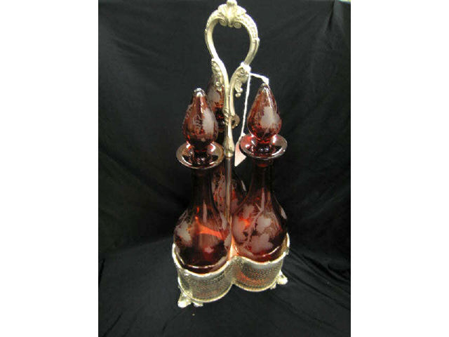 Appraisal: Victorian Ruby Cut-to-Clear Tantilus triple bottle in silverplate holder