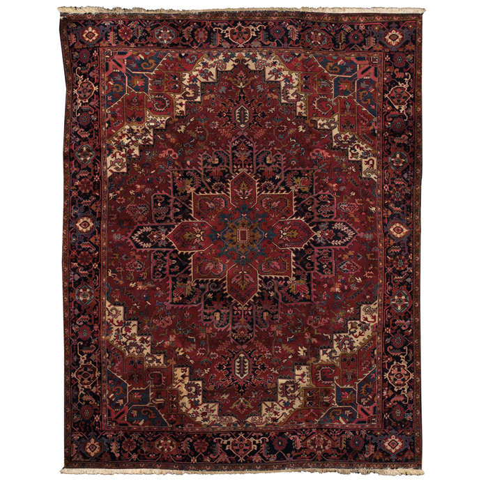 Appraisal: Heriz rug c stylized floral design on a red field