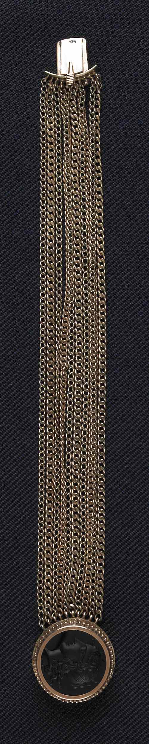 Appraisal: K yellow gold ten strand gold bracelet with intaglio clasp