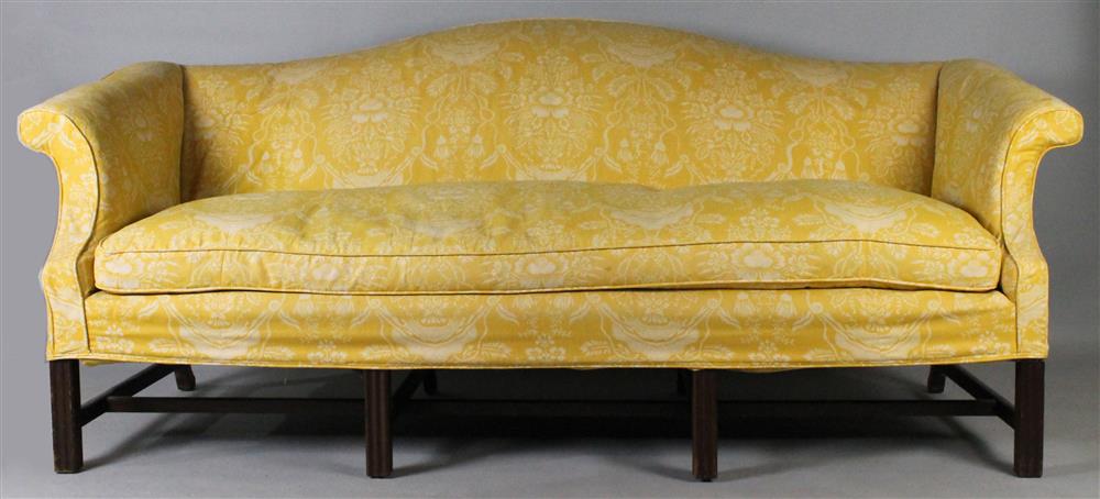 Appraisal: CHIPPENDALE STYLE MAHOGANY CAMELBACK SOFA having an arched crest rail