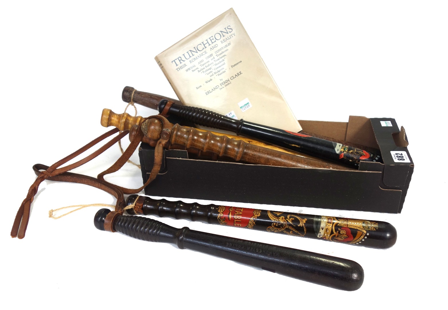 Appraisal: Two Elizabeth II wooden truncheons with gilt and painted decoration