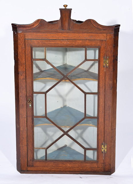 Appraisal: A TH CENTURY OAK AND GLAZED CORNER CUPBOARD fitted two