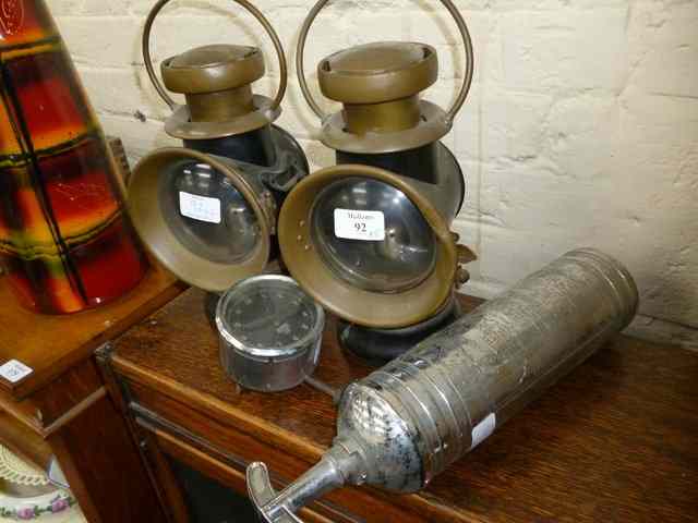 Appraisal: A PAIR OF 'LUCAS'S PETROLEUM MOTOR-LAMPS' together with a Smiths