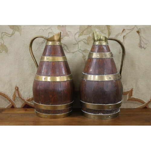 Appraisal: Rare pair of antique French wooden staved pitchers with brass