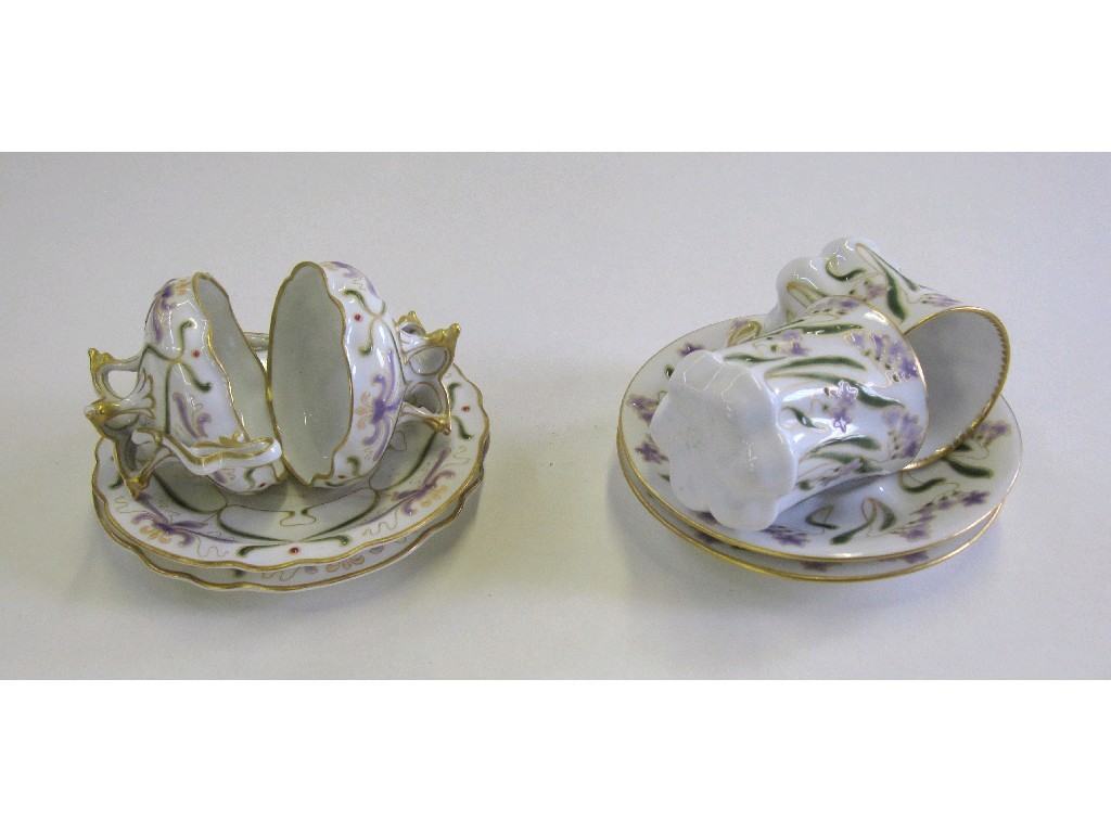 Appraisal: Four continental cabinet cups and saucers with floral decoration one