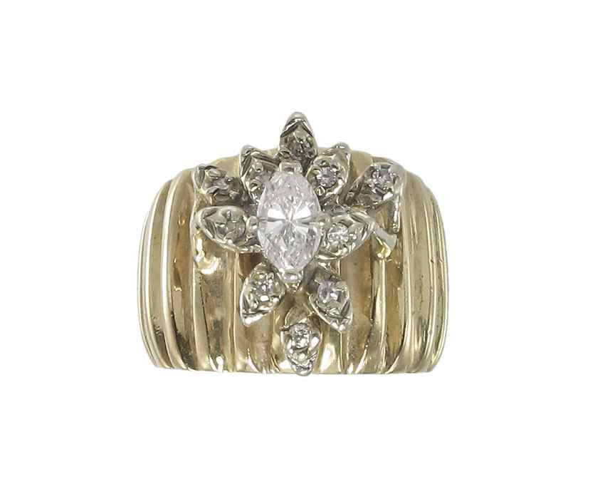 Appraisal: K DIAMOND RING K yellow gold ring contains one marquise