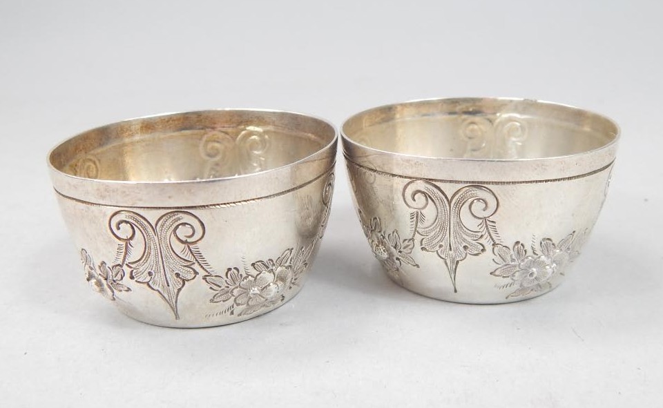 Appraisal: A pair of Victorian silver salts each embossed with flowers