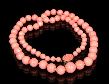 Appraisal: Fine Angel Skin Coral Graduated Bead Necklace with a Carved