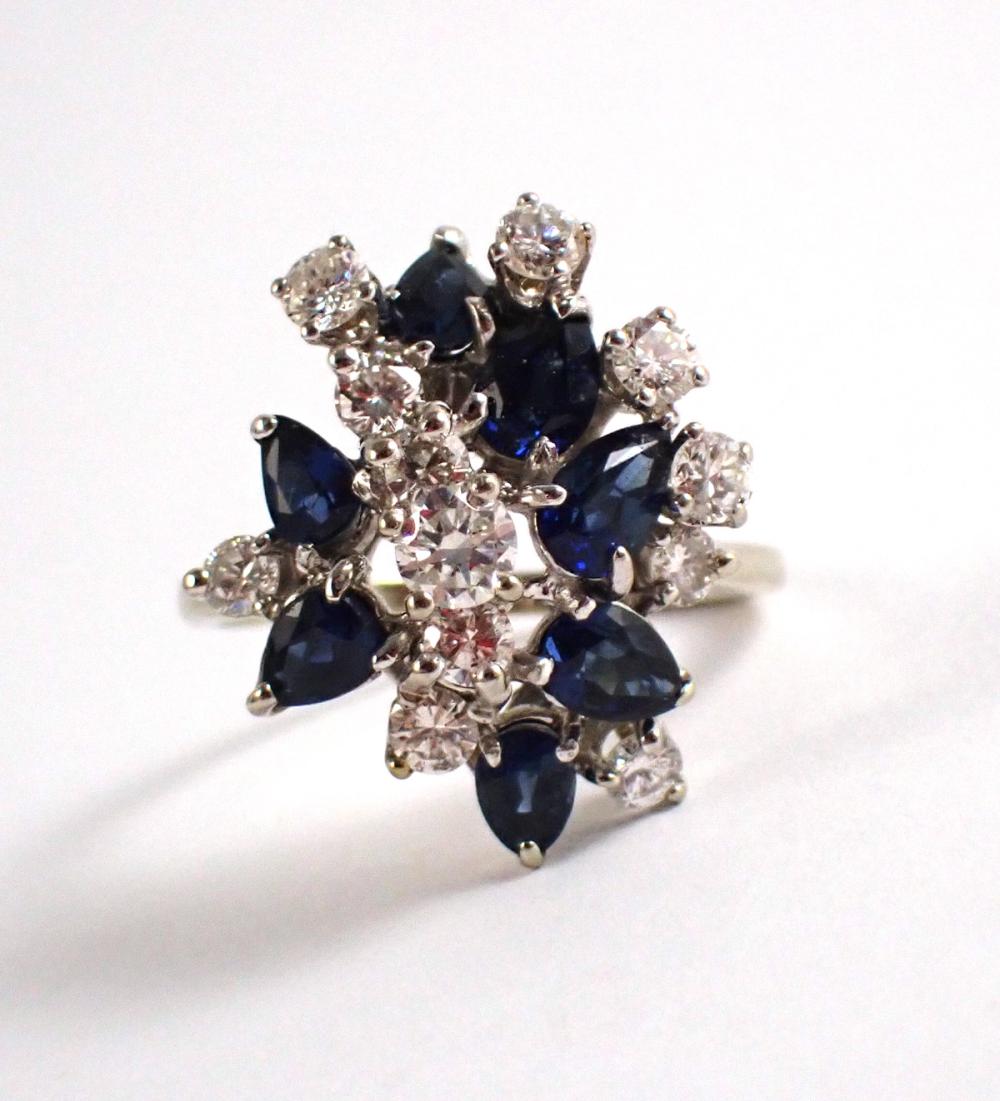 Appraisal: DIAMOND SAPPHIRE AND FOURTEEN KARAT WHITE GOLD RING with a