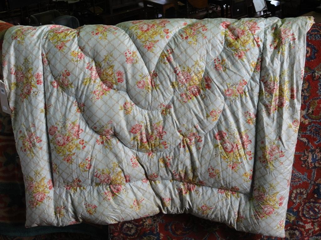 Appraisal: A vintage eiderdown with a floral chintz pattern on a