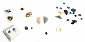 Appraisal: A collection of unset gemstones including opals and star sapphires