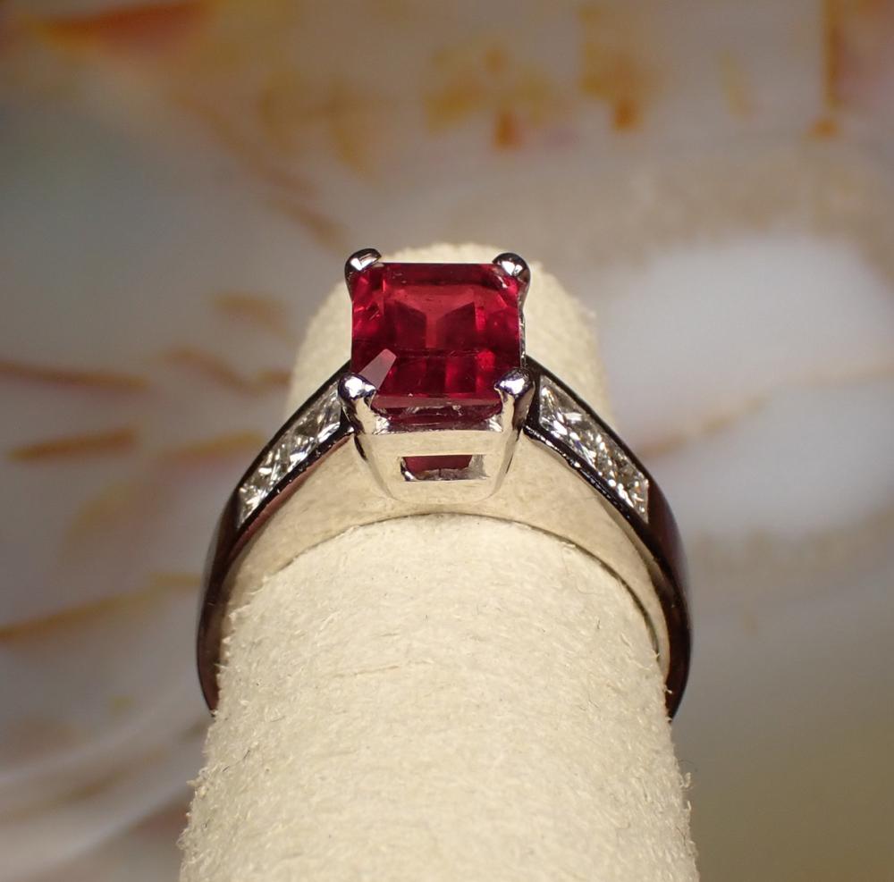 Appraisal: RUBY DIAMOND AND PLATINUM RING invisible set with a pair