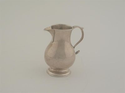 Appraisal: An early George II sparrow beak cream jug of baluster