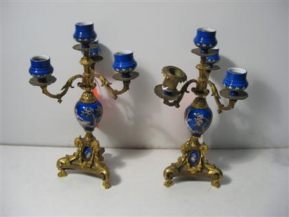 Appraisal: Pair of Continental porcelain and gilt metal candelabraEach with four