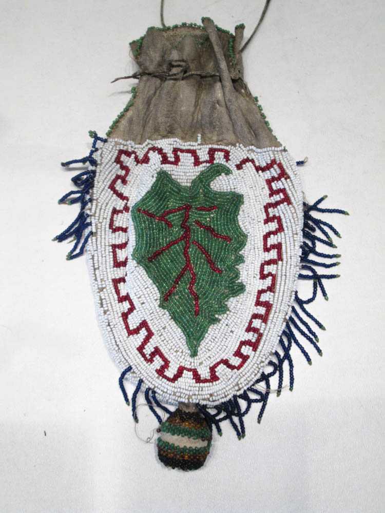 Appraisal: NATIVE AMERICAN BEADED DOUBLE SIDED ANIMAL HYDE BAG depicting a