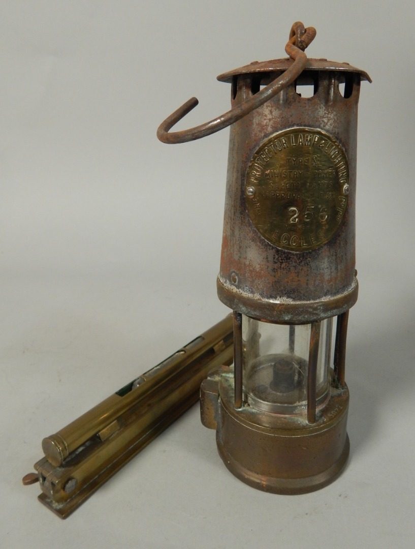 Appraisal: A Protector Lamp and Lighting Company miner's lamp and a