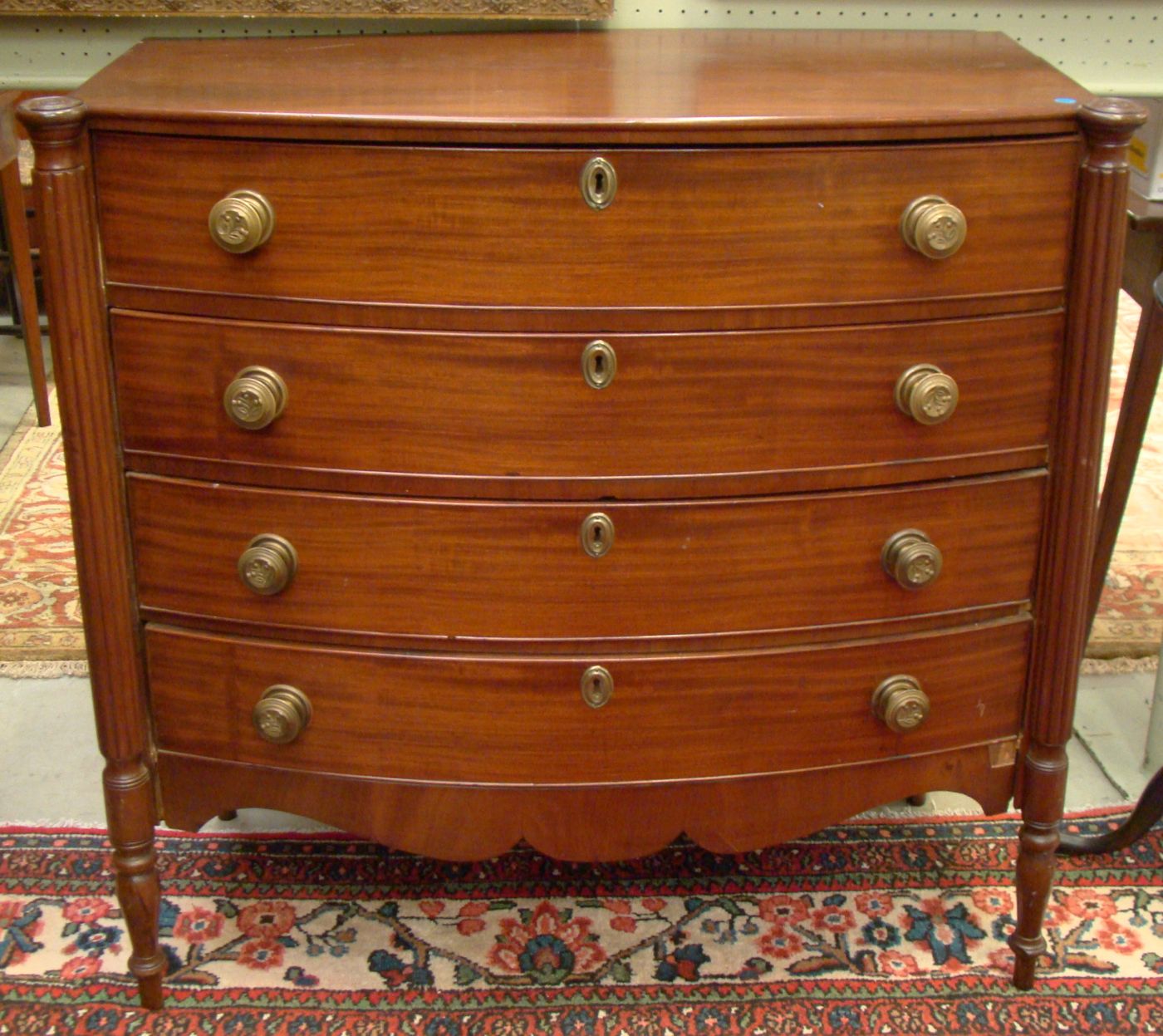 Appraisal: ANTIQUE AMERICAN SHERATON BOWFRONT BUREAU Circa With cookie corners Four