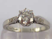 Appraisal: A white metal tests carat gold and platinum diamond solitaire