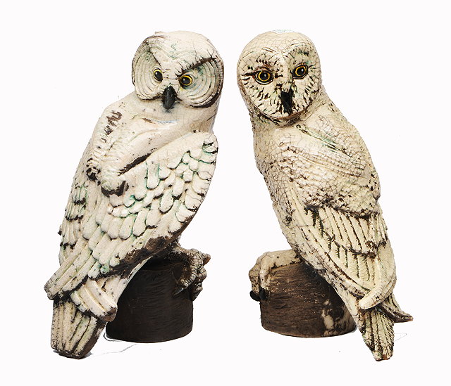 Appraisal: A PAIR OF CRACKLE GLAZE POTTERY OWLS each cm in