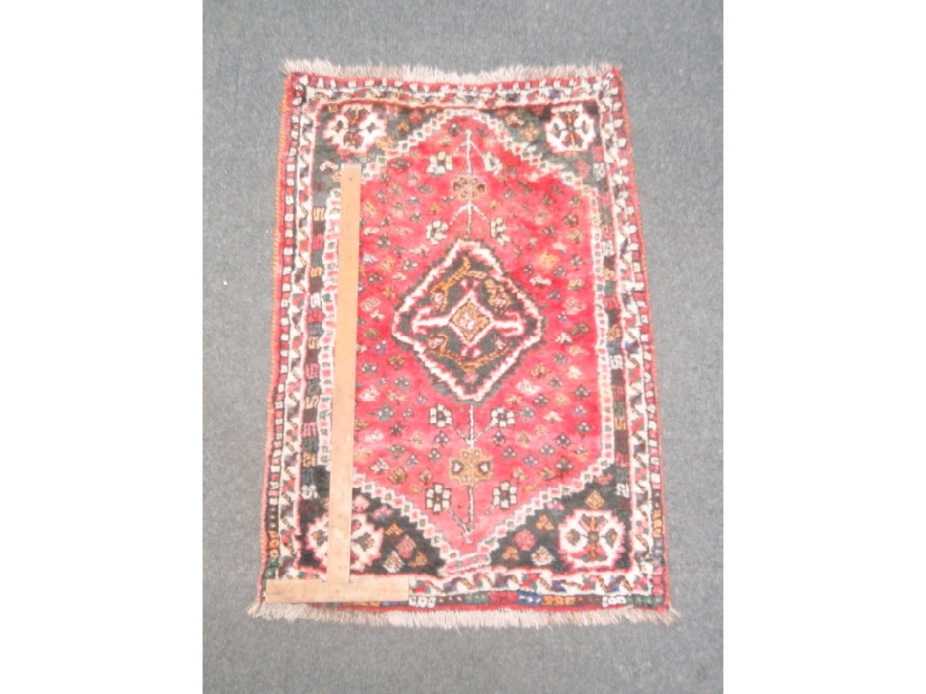 Appraisal: A red ground Persian design rug cm x cm